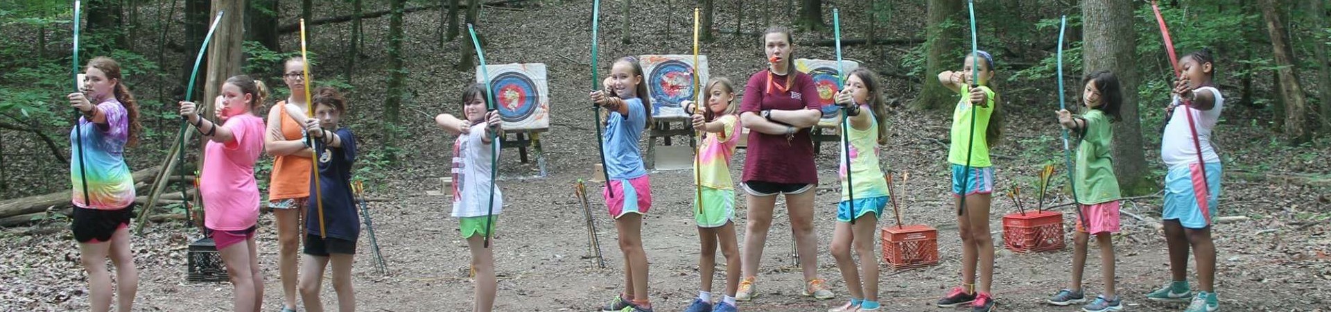  girls aiming empty bows 