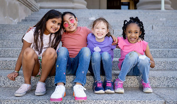 girl scouts sitting on steps