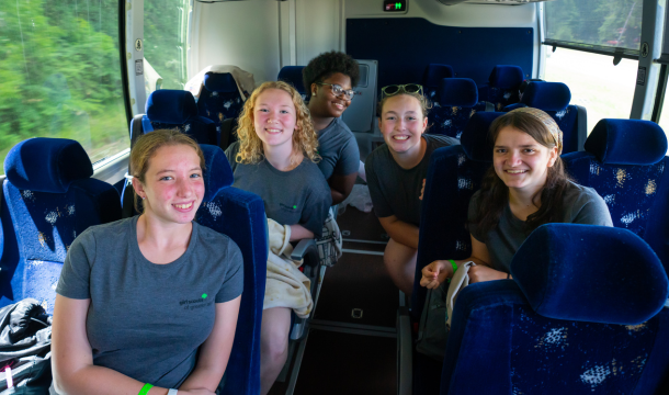 girl scouts on a bus
