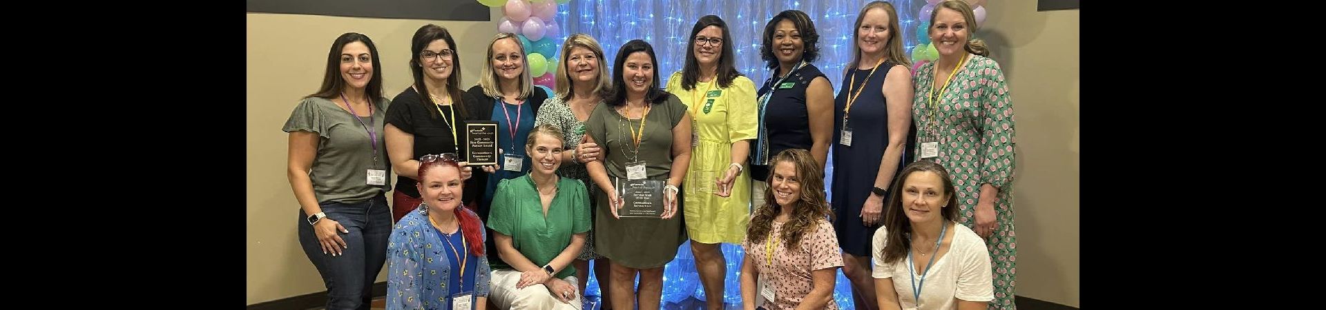  group of volunteers with awards 